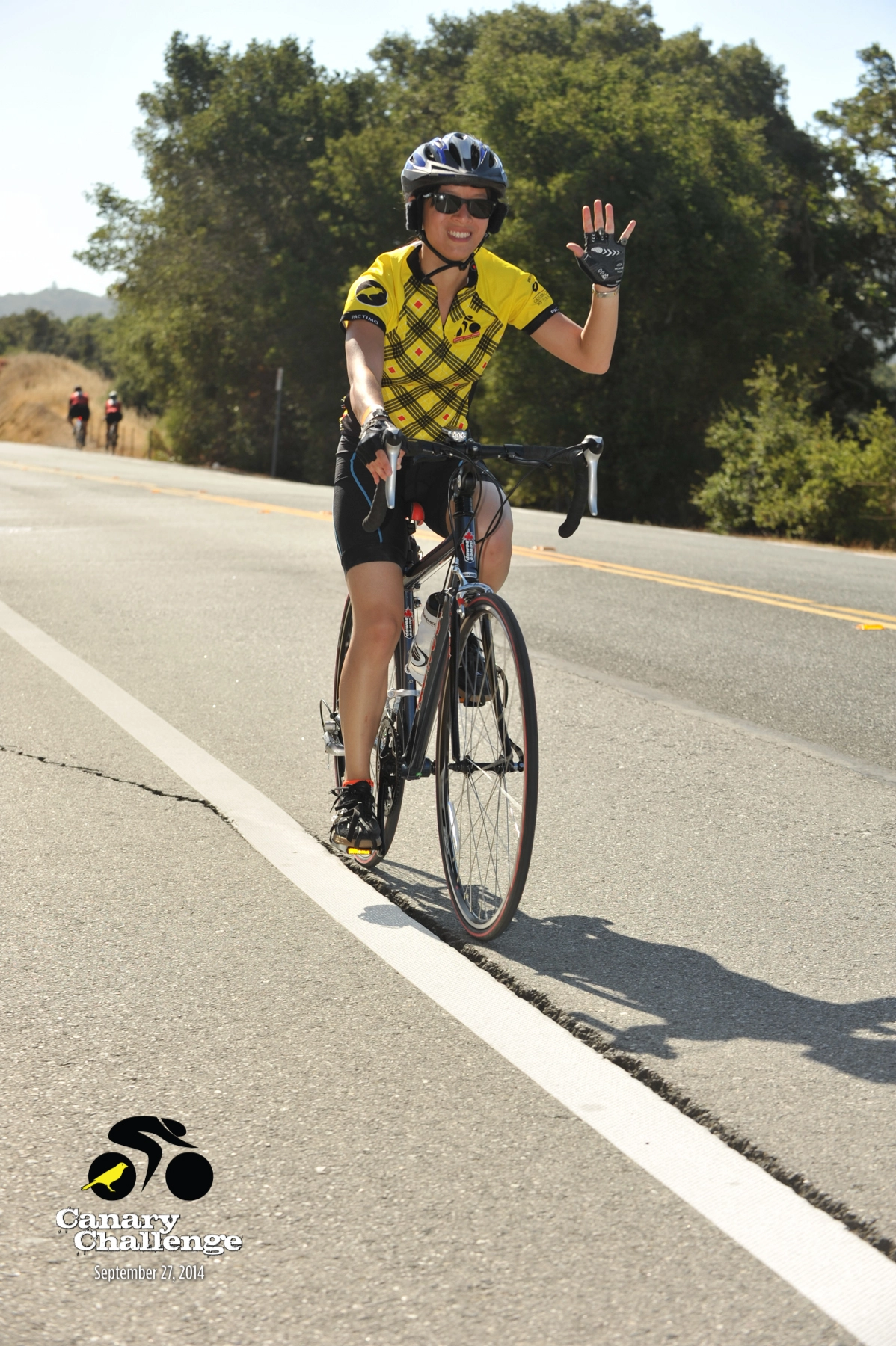 Historic photo of Canary Challenge cyclist in yellow jersey from past fundraising cycling events